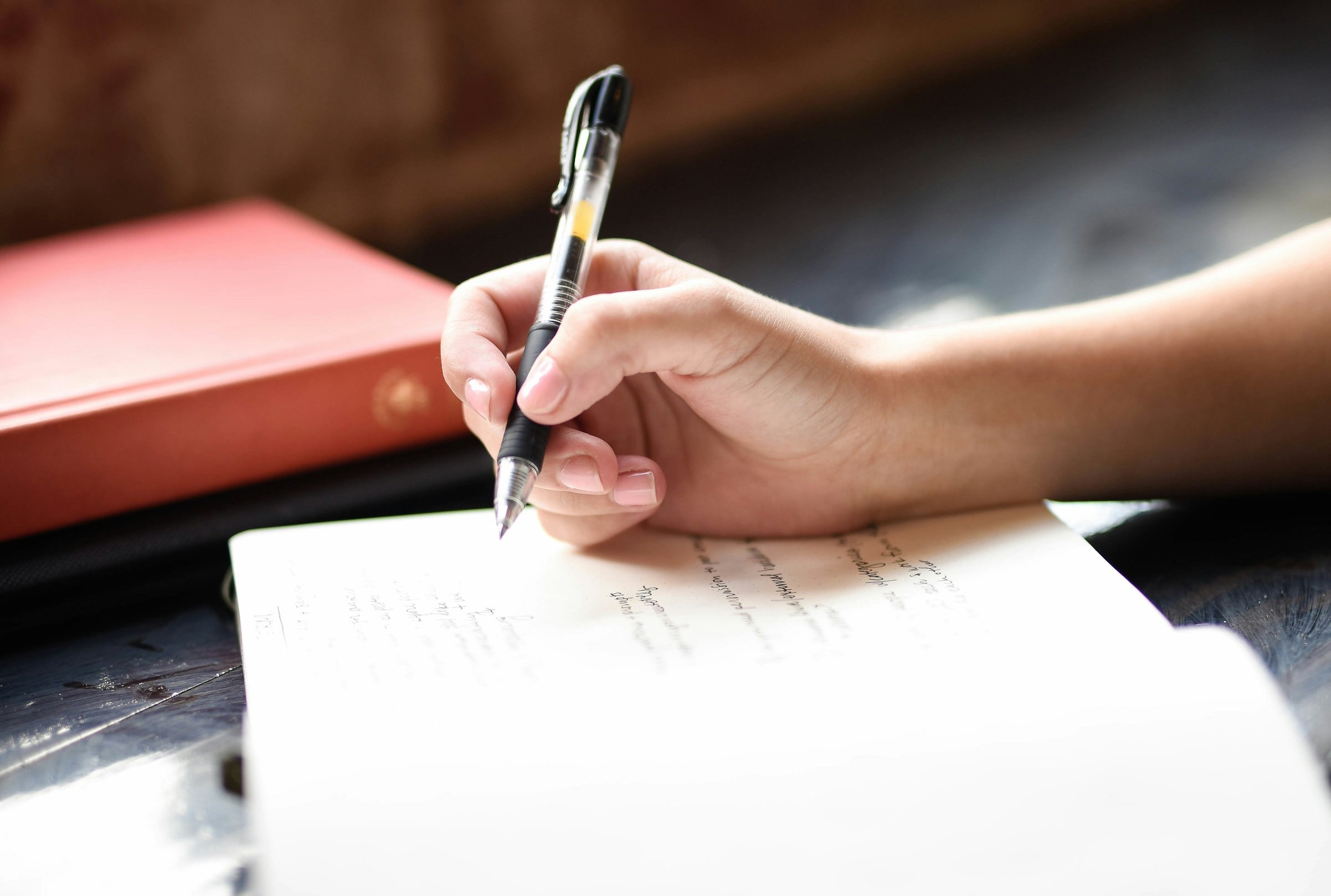 A person manually editing AI text on a laptop